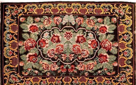 Traditional Bhadohi carpet featuring intricate floral pattern and rich colors, perfect for Indian homes