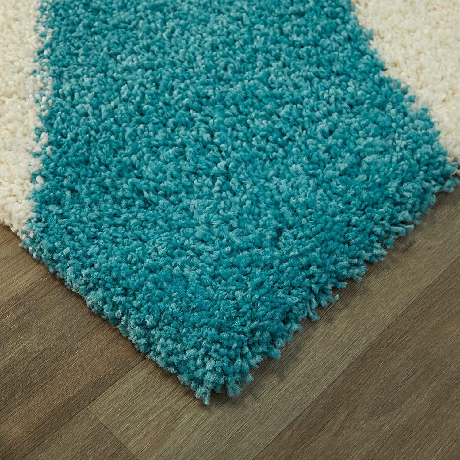 Aqua blue and white shaggy carpet rug on wooden floor, Bhadohi Carpets House