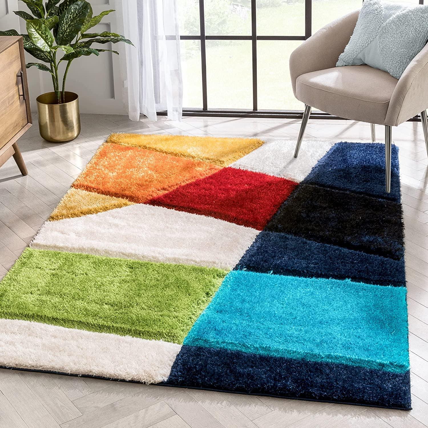 Colorful geometric shaggy carpet rug in a modern living room by Bhadohi Carpets House