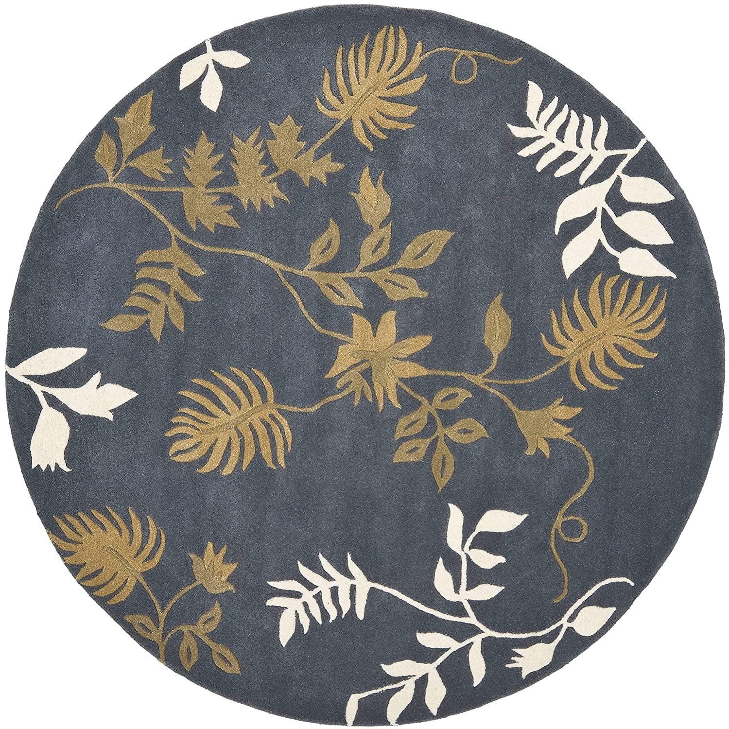 Round blue wool carpet with gold and white leaf pattern from Bhadohi Carpets House