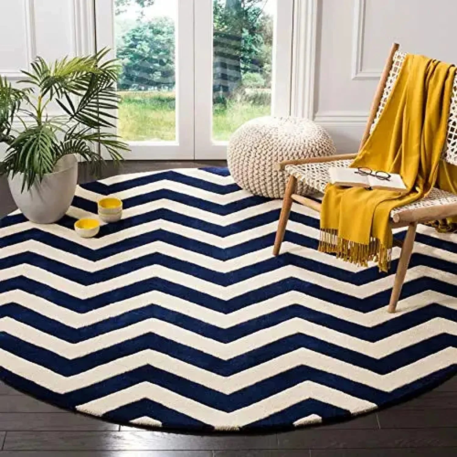 Blue and white zigzag round wool carpet from Bhadohi Carpets House in a modern living room