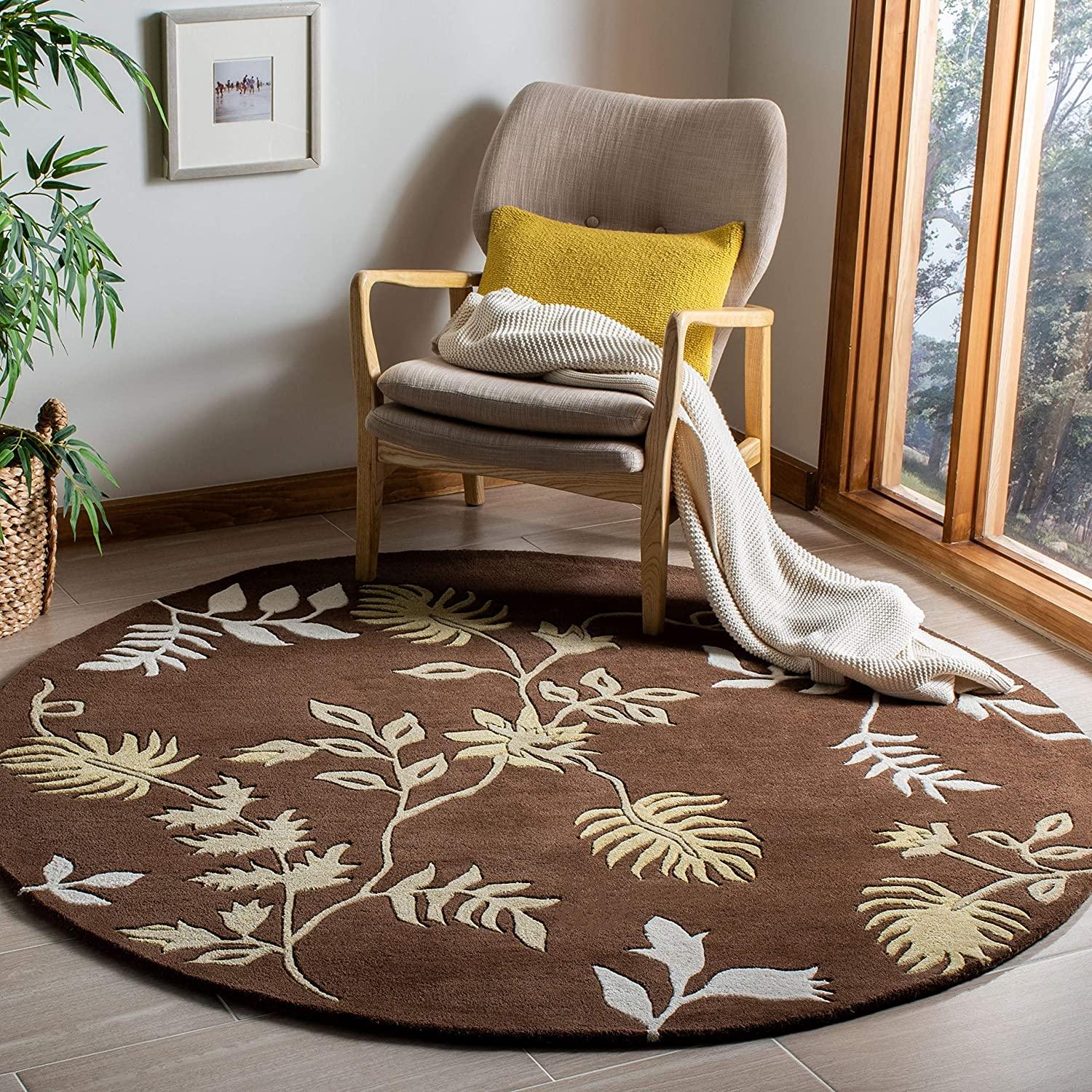 Brown round wool leaf-patterned carpet rug in cozy living room, Bhadohi Carpets House