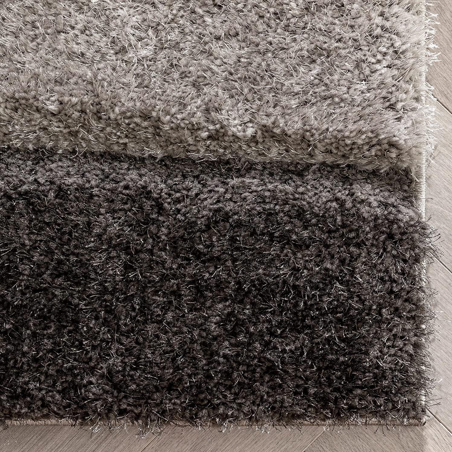 Close-up of dual-tone shaggy carpet rug texture from Bhadohi Carpets House on floor
