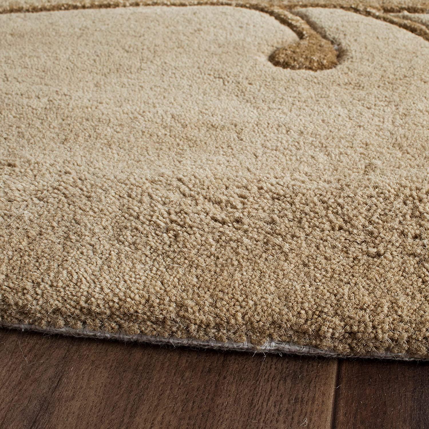 Camel Berry round wool carpet rug by Bhadohi Carpets House on wooden floor