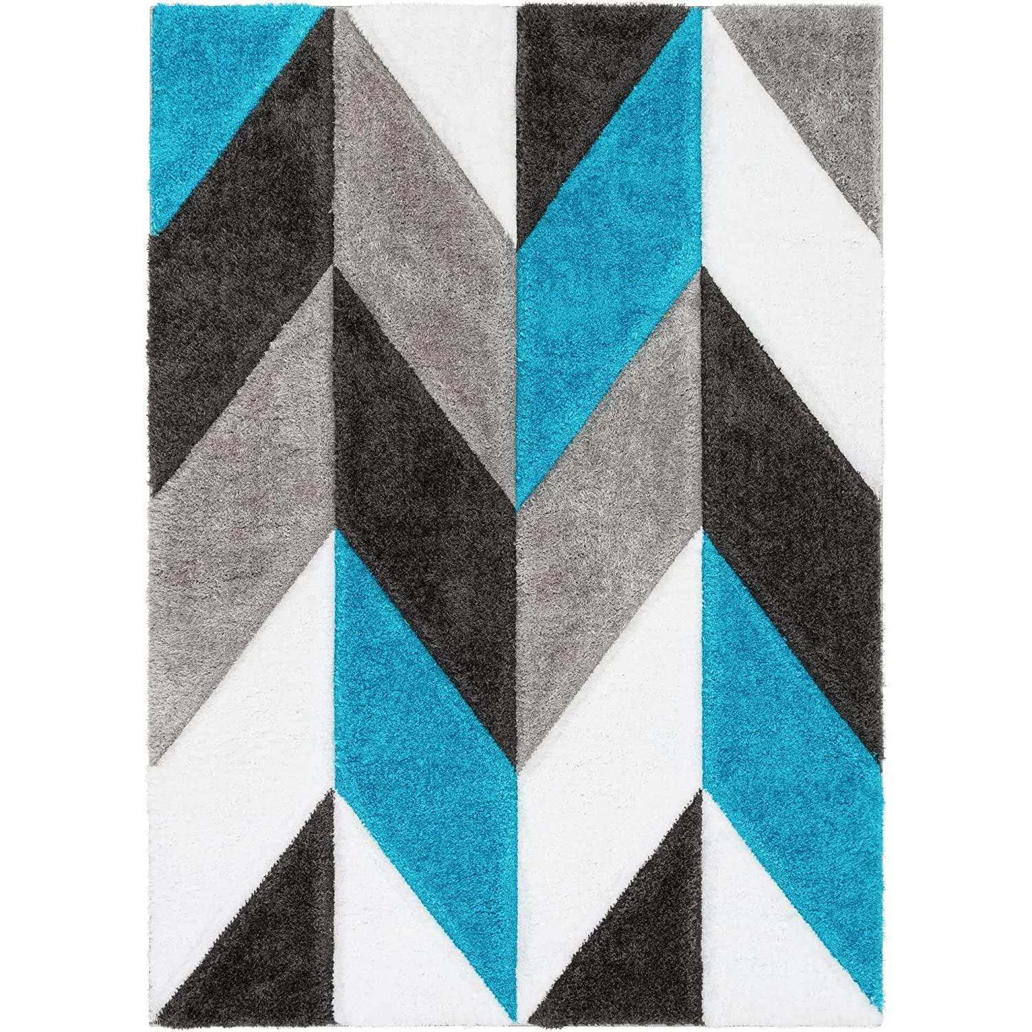 Modern shaggy carpet rug with blue, grey, black, and white geometric chevron design.
