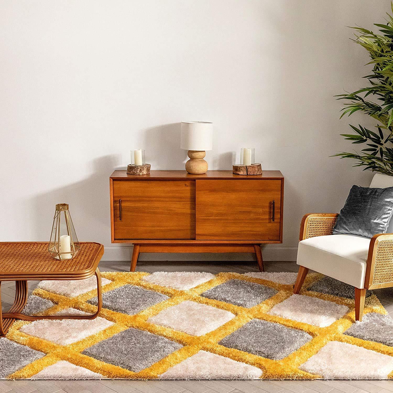 Modern living room with yellow and grey shaggy carpet rug, wooden furniture, and indoor plant