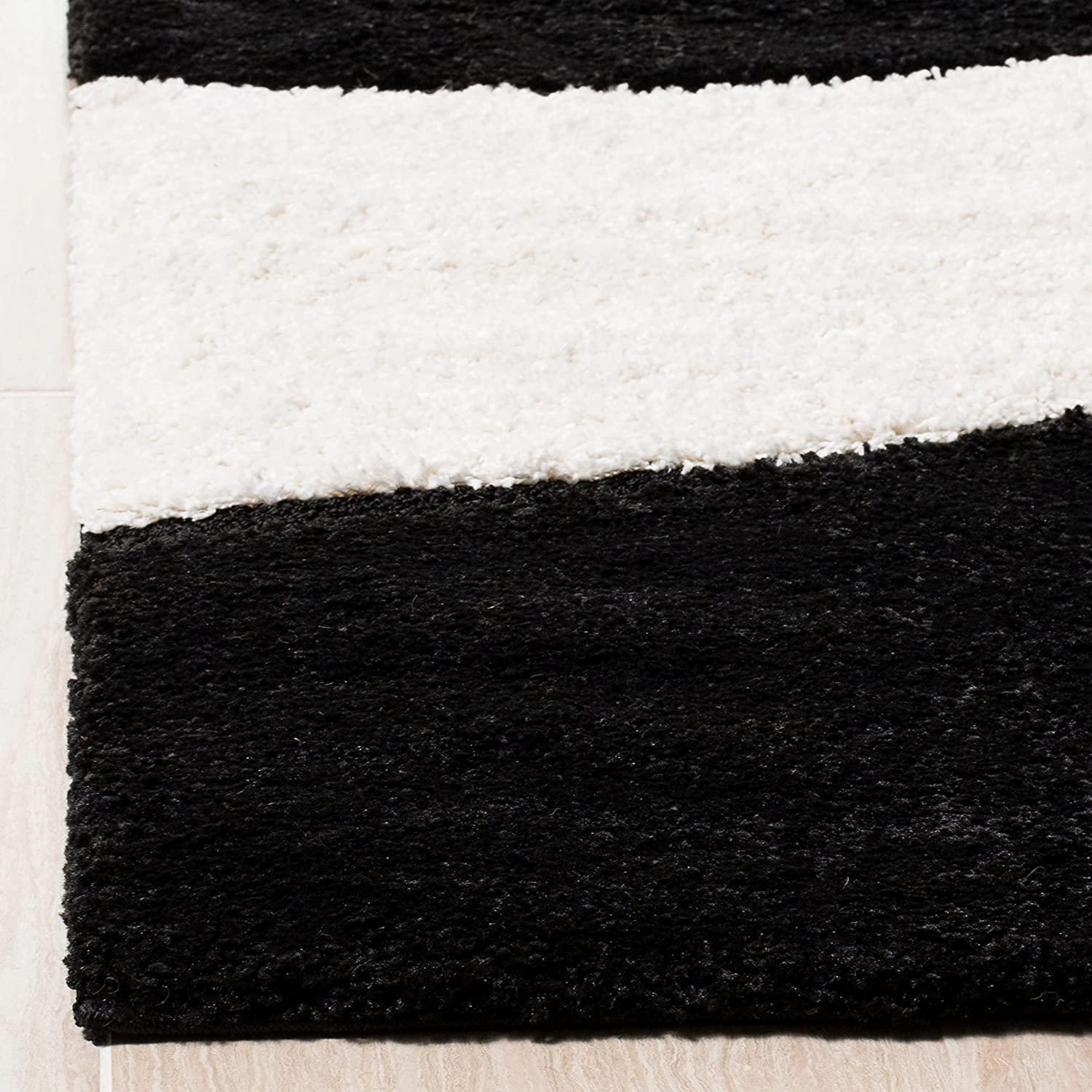 Shaggy black and white striped carpet rug on light wood floor from Bhadohi Carpets House