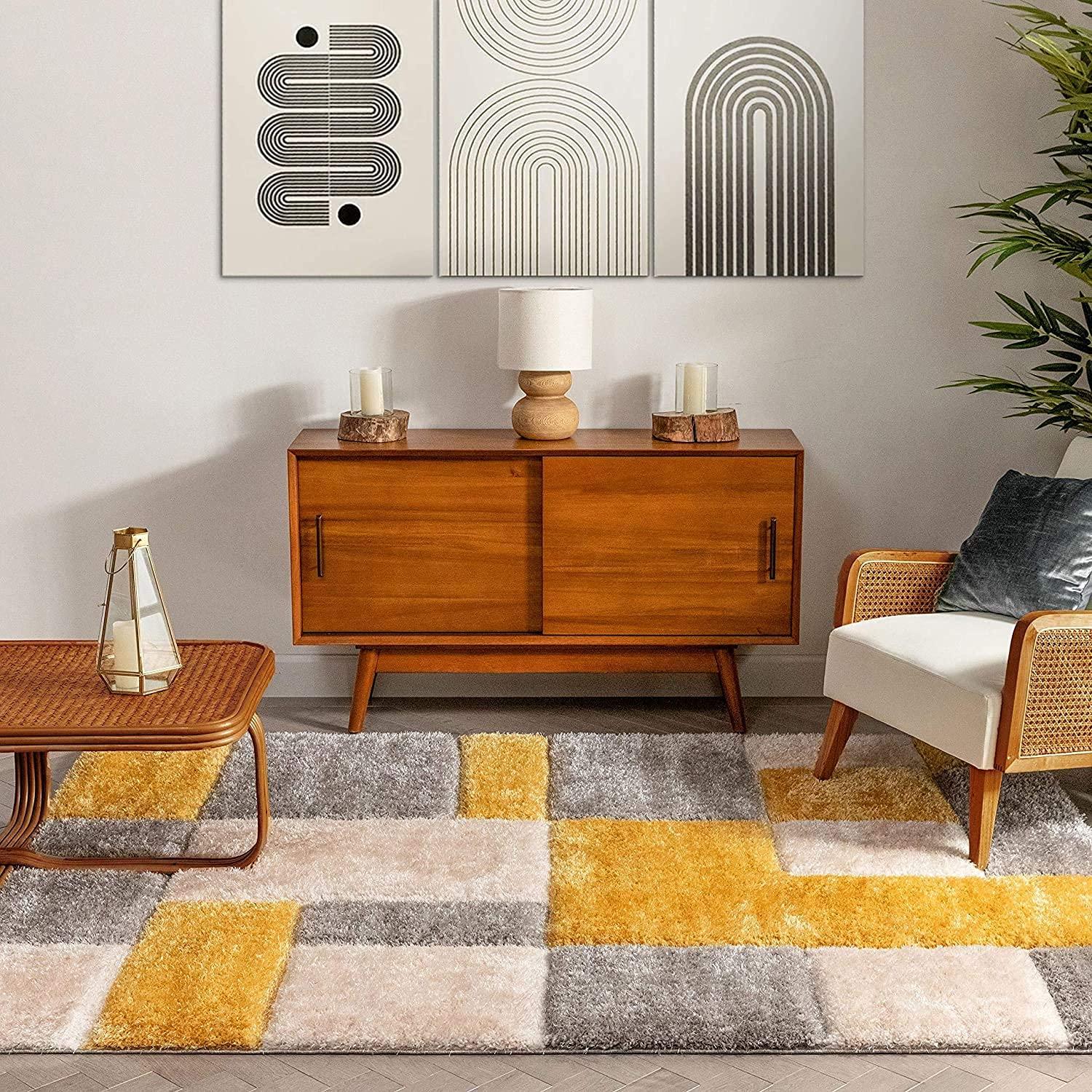 Modern living room with a Bhadohi Carpets House shaggy rug in yellow, grey, and beige blocks.