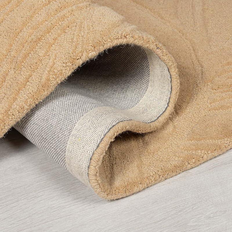 Close-up of a beige cut loop carpet rug from Bhadohi Carpets House on a light floor