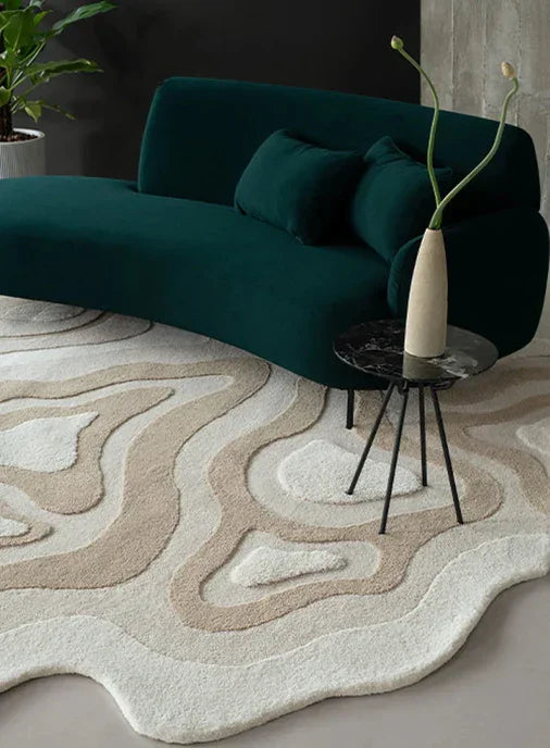 Modern living room with green sofa and abstract irregular beige and white Bhadohi carpet rug