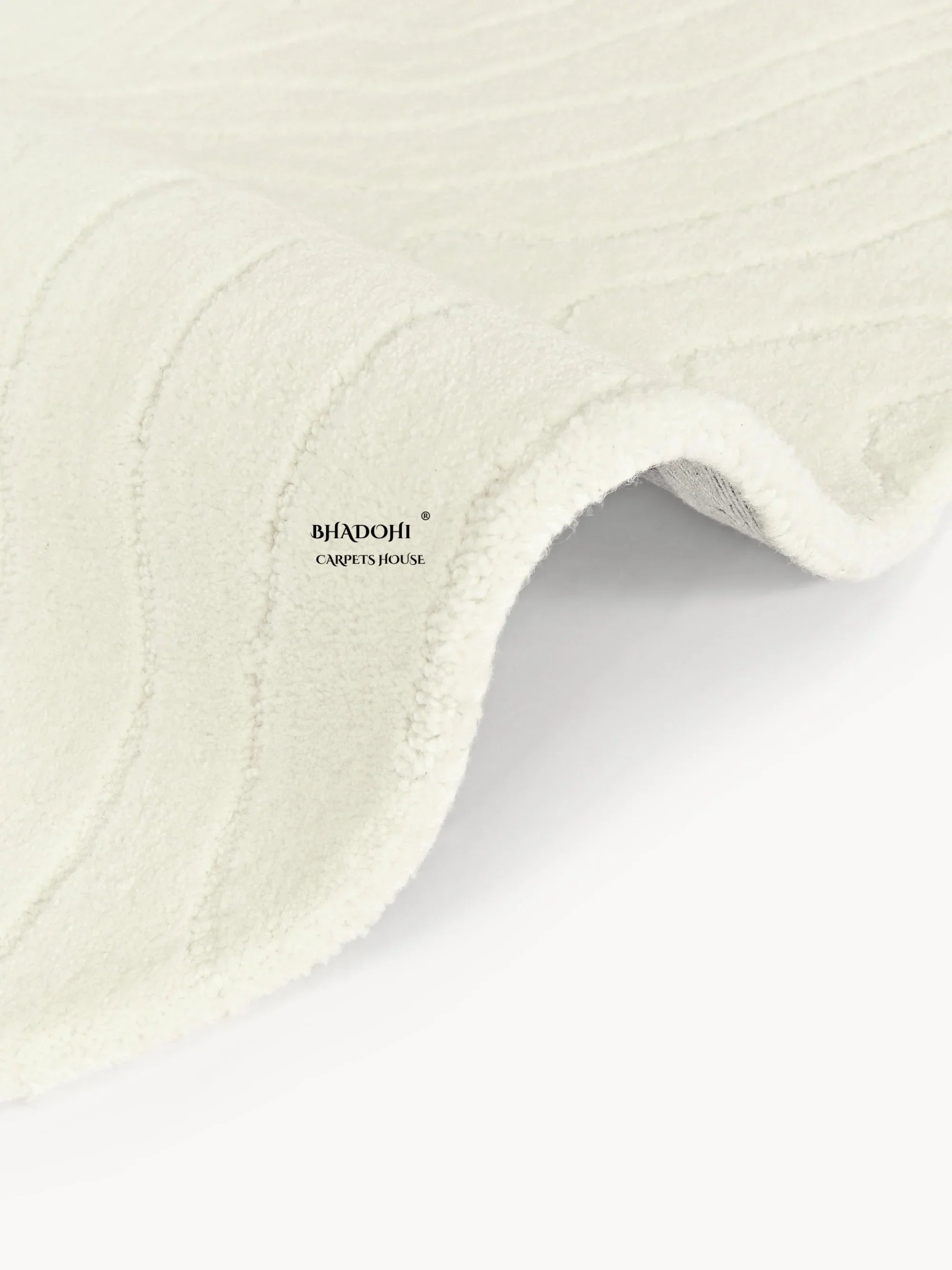 Off-white round wool carpet with subtle wave pattern by Bhadohi Carpets House