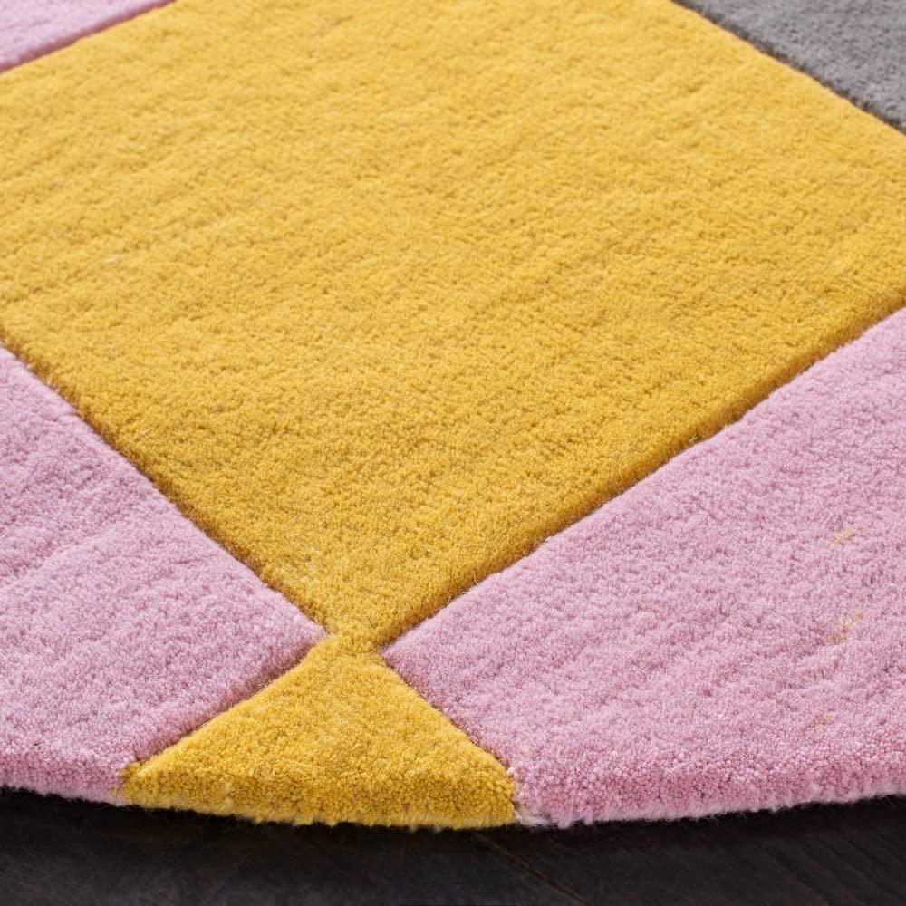 Close-up of Bhadohi Carpets House round wool rug with yellow, pink, and grey geometric design