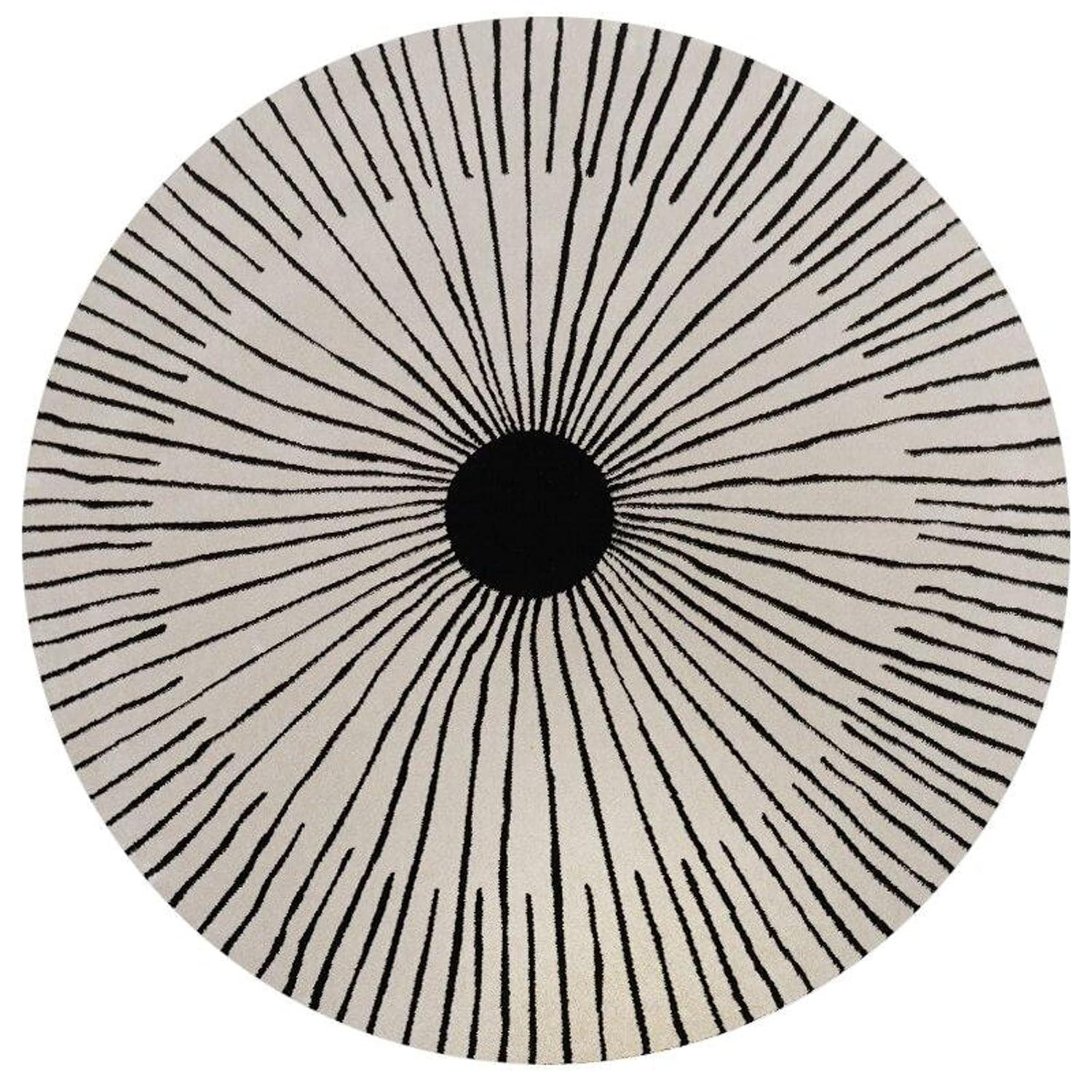 Round wool carpet with black sunburst pattern, modern rug by Bhadohi Carpets House.