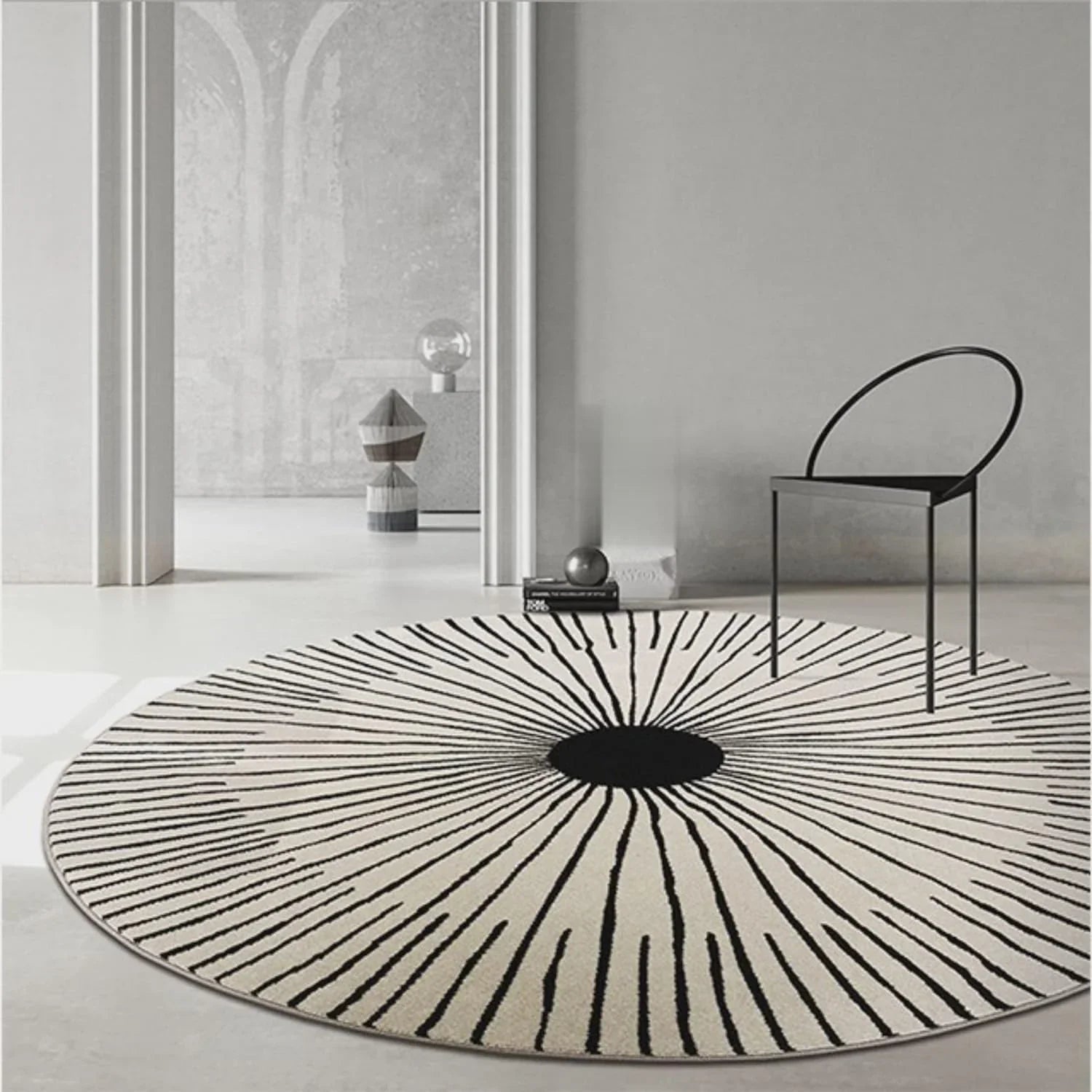 Round wool carpet rug with black sunburst design in a modern minimalist living room from Bhadohi Carpets House
