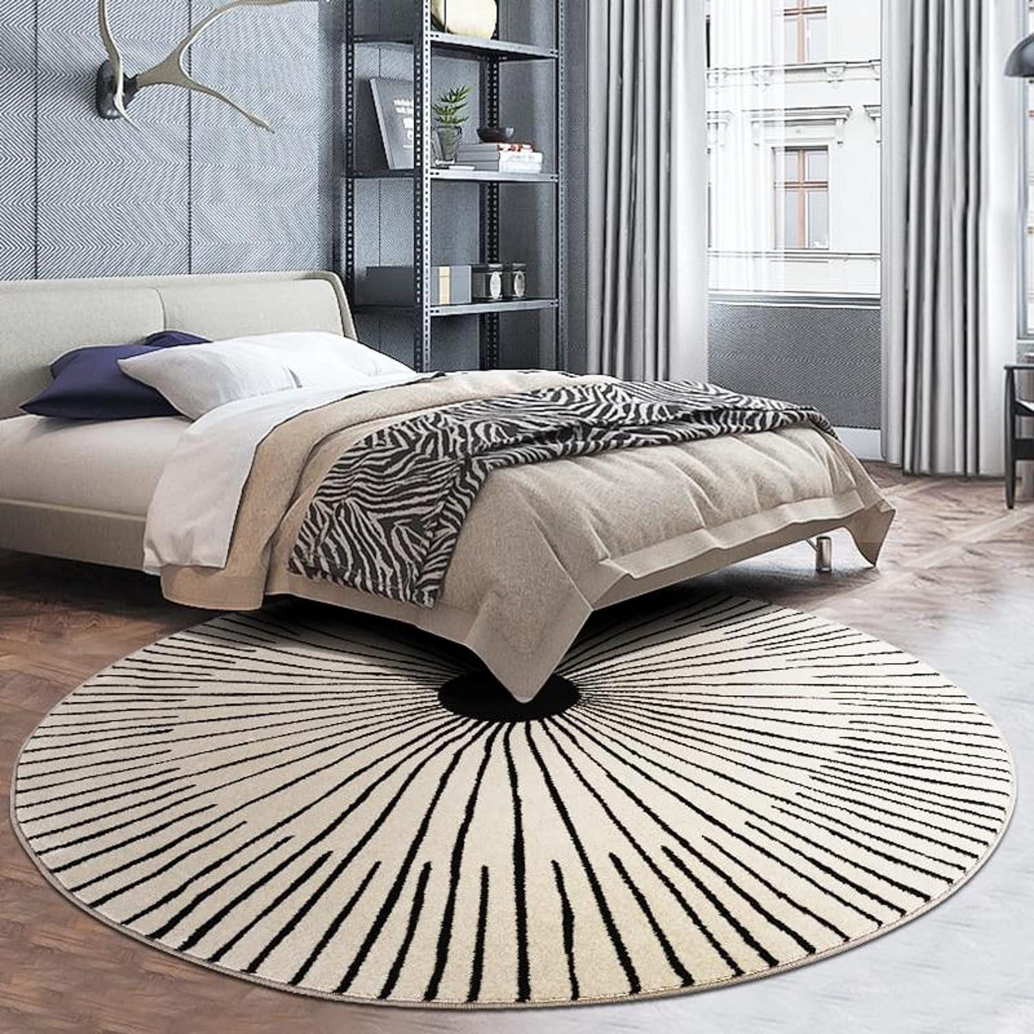 Modern bedroom with round ethno wool carpet from Bhadohi Carpets House on wooden floor