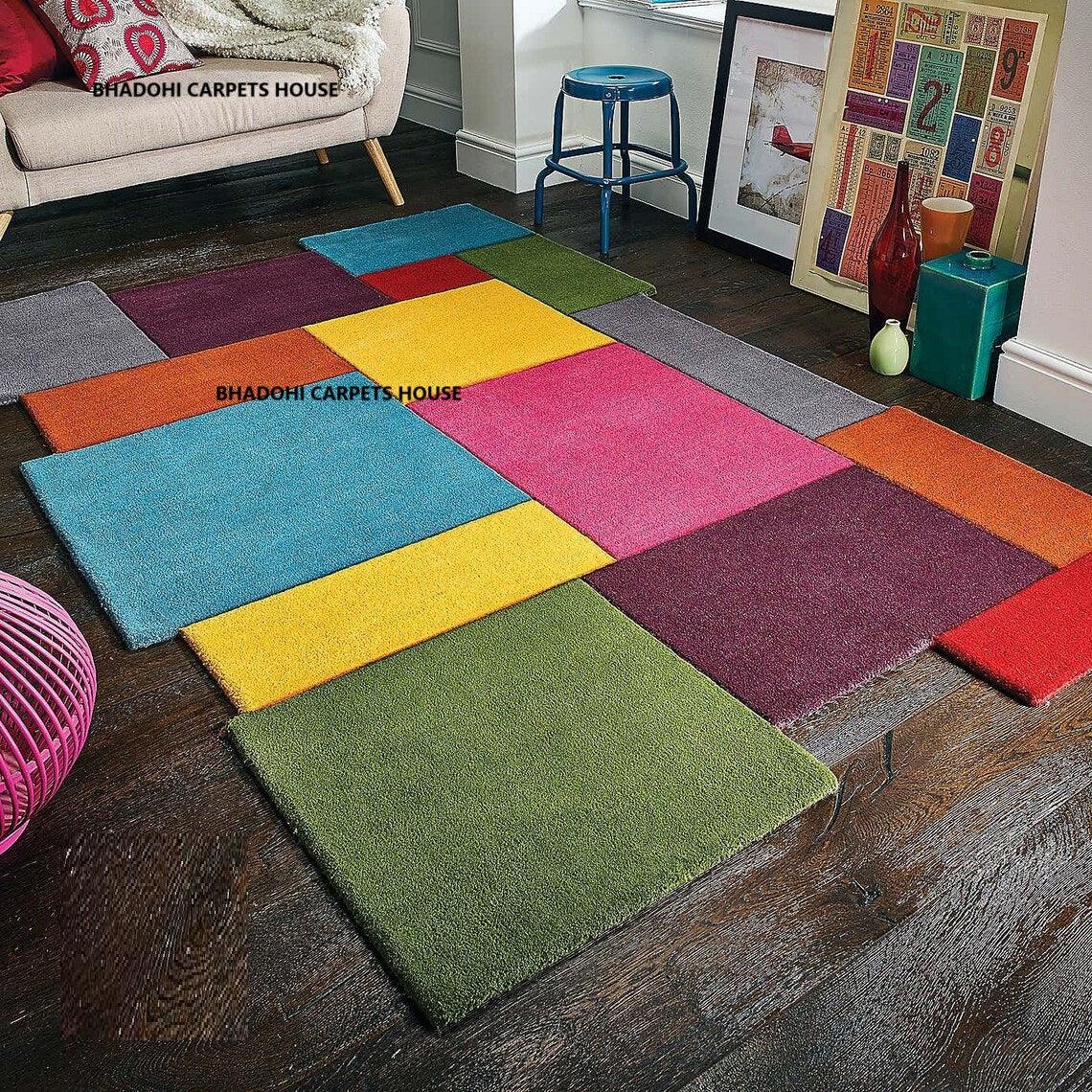 Colorful patchwork carpet rug by Bhadohi Carpets House in a modern Indian living room