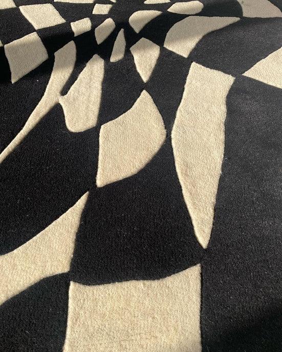 Black and cream irregular pattern carpet rug from Bhadohi Carpets House, modern design.