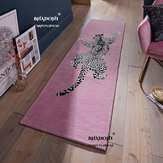 Handmade pink wool runner carpet with climbing jaguar design by Bhadohi Carpets House