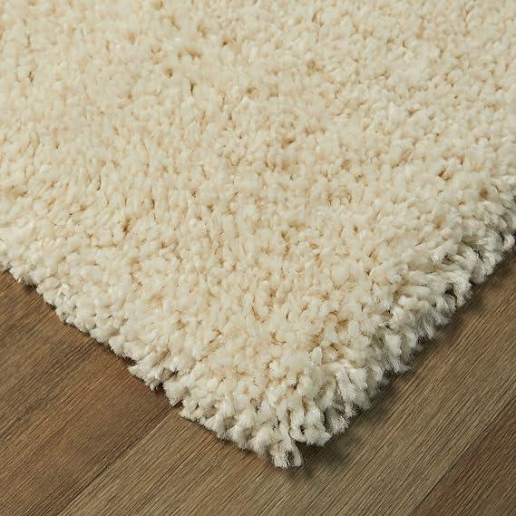 Beige shaggy carpet rug on wooden floor, Bhadohi Carpets House premium home decor