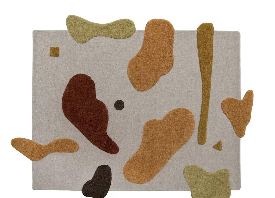 Modern abstract Bhadohi carpet rug with irregular multicolor shapes on a beige background.
