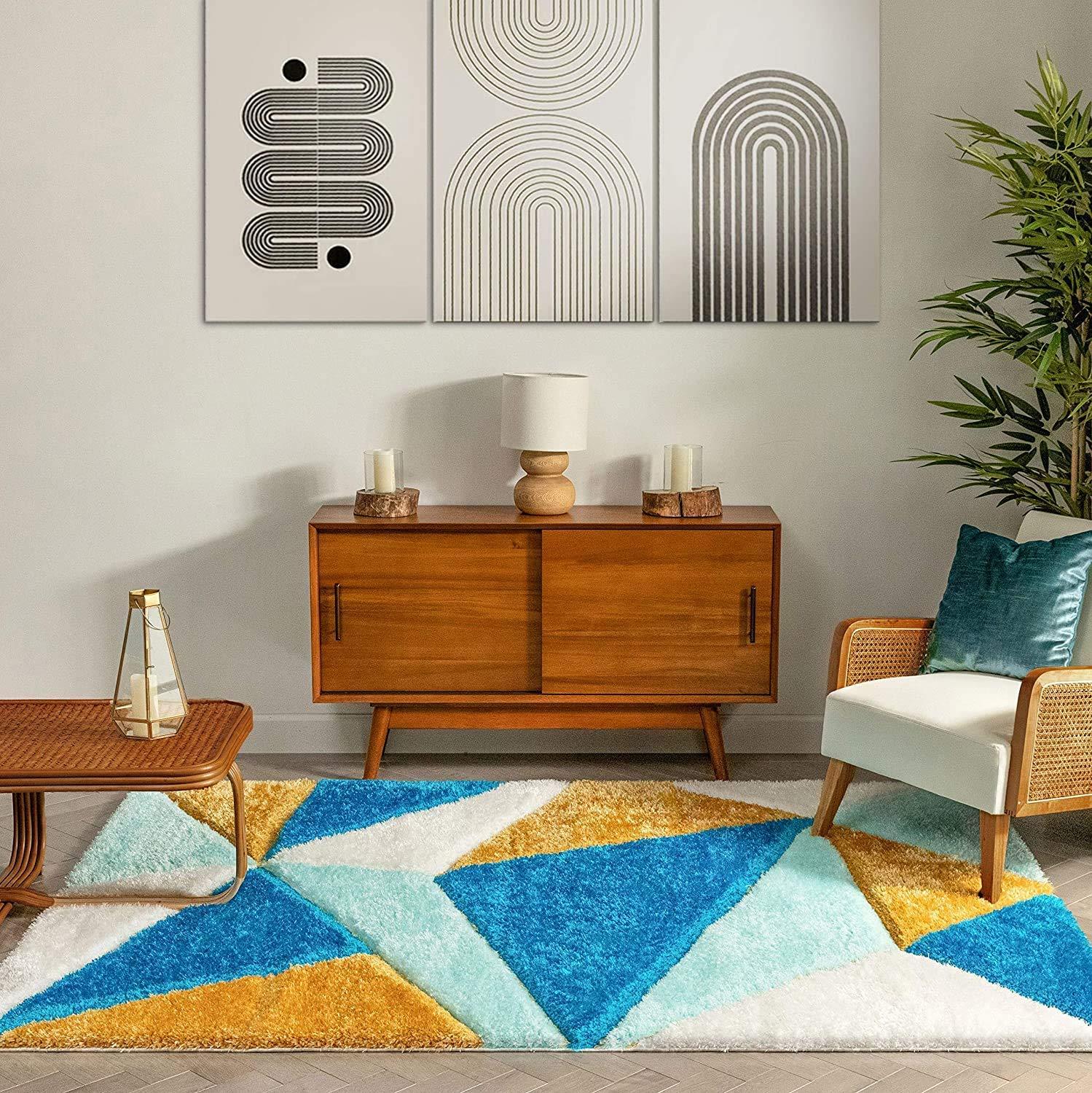 Geometric blue, white and yellow shaggy carpet rug in a modern Indian living room by Bhadohi Carpets House.