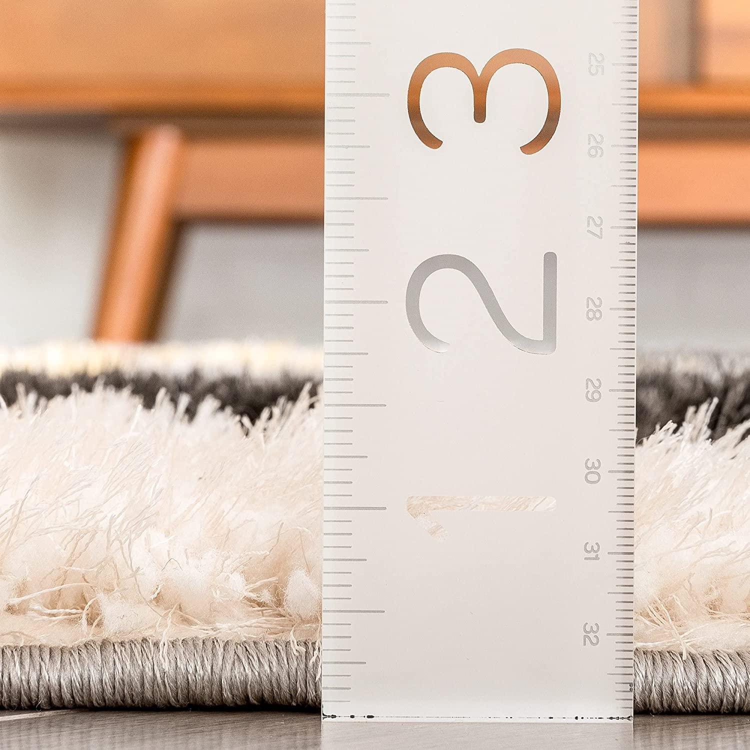 Close-up of a fluffy cream shaggy carpet rug with ruler showing pile height, Bhadohi Carpets House