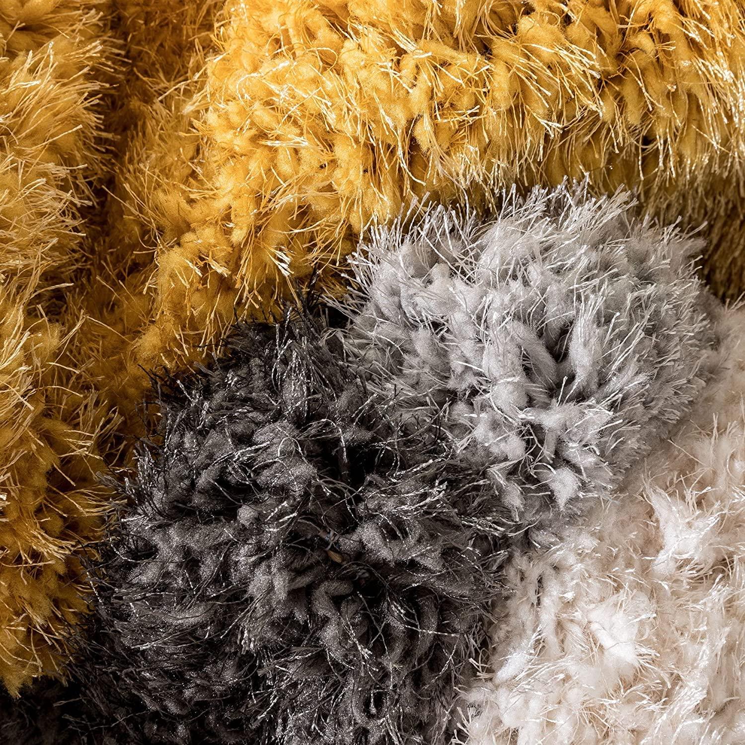 Textured close-up of multi-color shaggy carpets from Bhadohi Carpets House, India