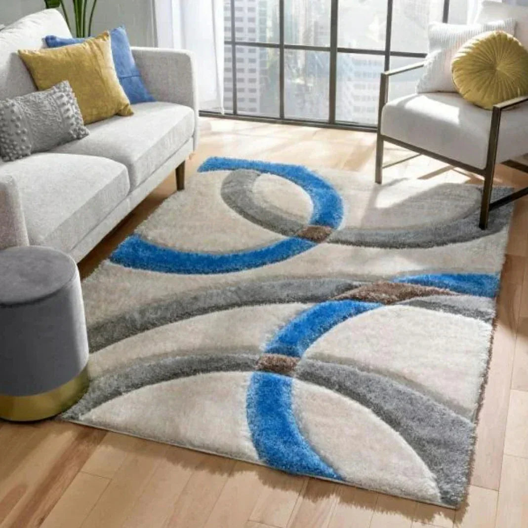 Modern shaggy carpet with blue, grey, and beige geometric design in a bright living room