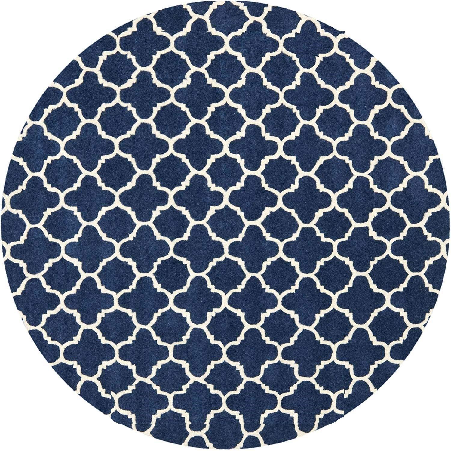 Navy blue round wool carpet with geometric white pattern from Bhadohi Carpets House