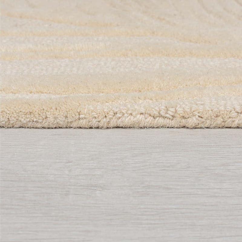 Close-up of beige loop carpet rug texture from Bhadohi Carpets House on light floor