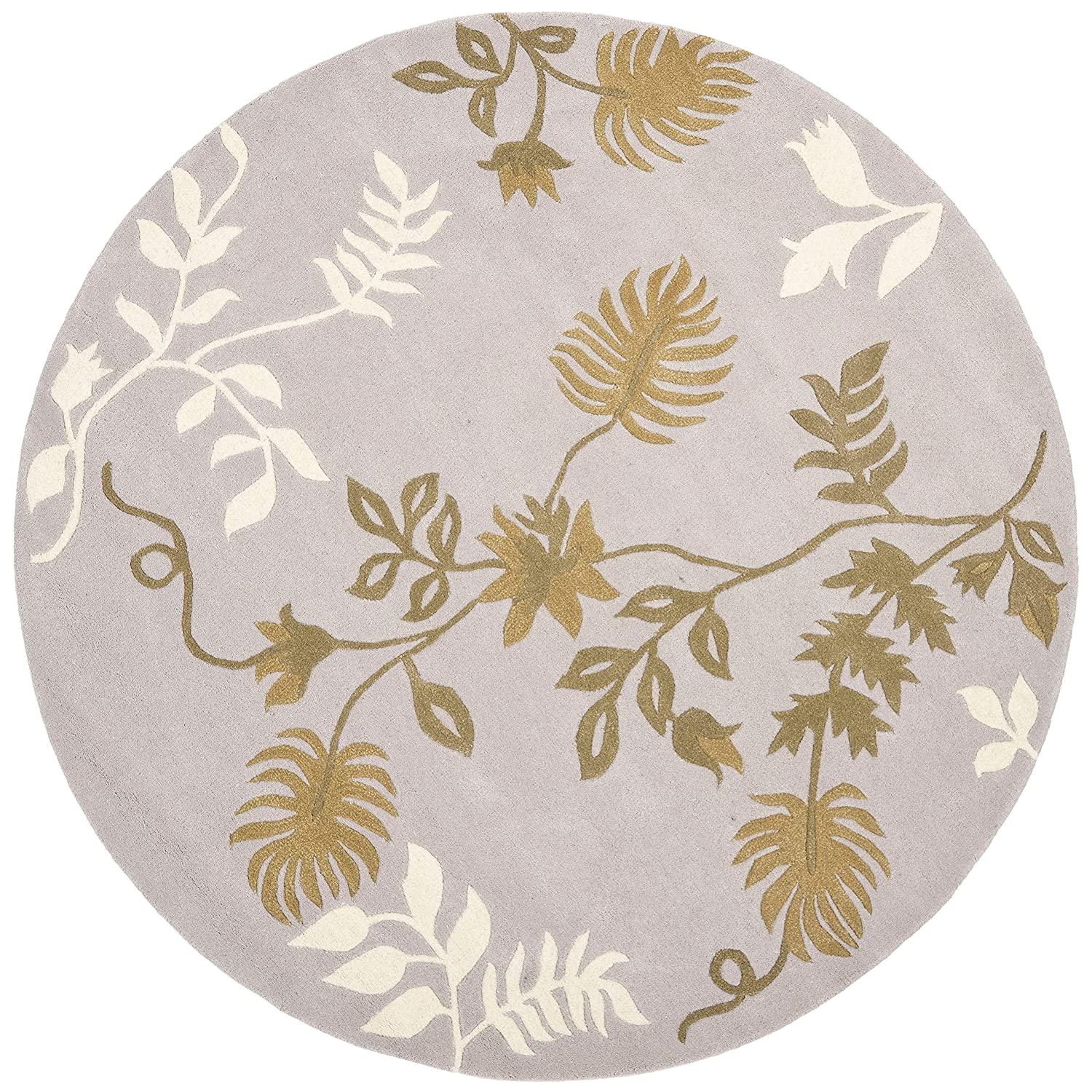 Round wool carpet with peach and cream leaf pattern from Bhadohi Carpets House