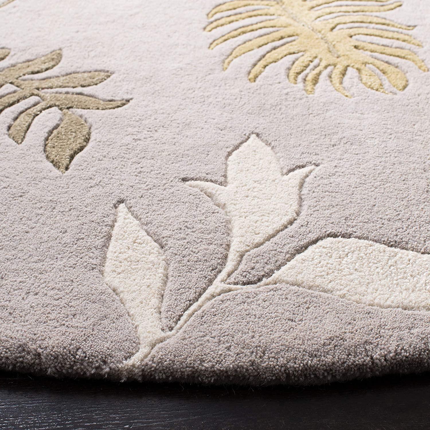 Round wool carpet rug with embossed peach leaf and floral design, Bhadohi Carpets House