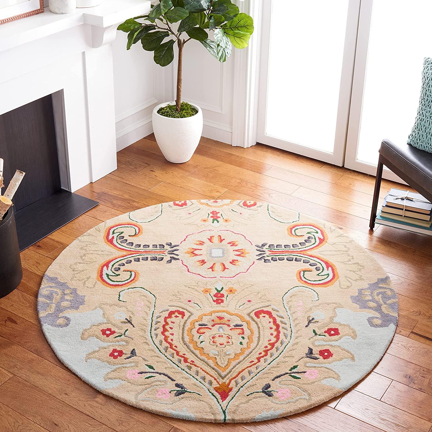 Round peach peacock feather wool carpet rug in a modern living room, Bhadohi Carpets House