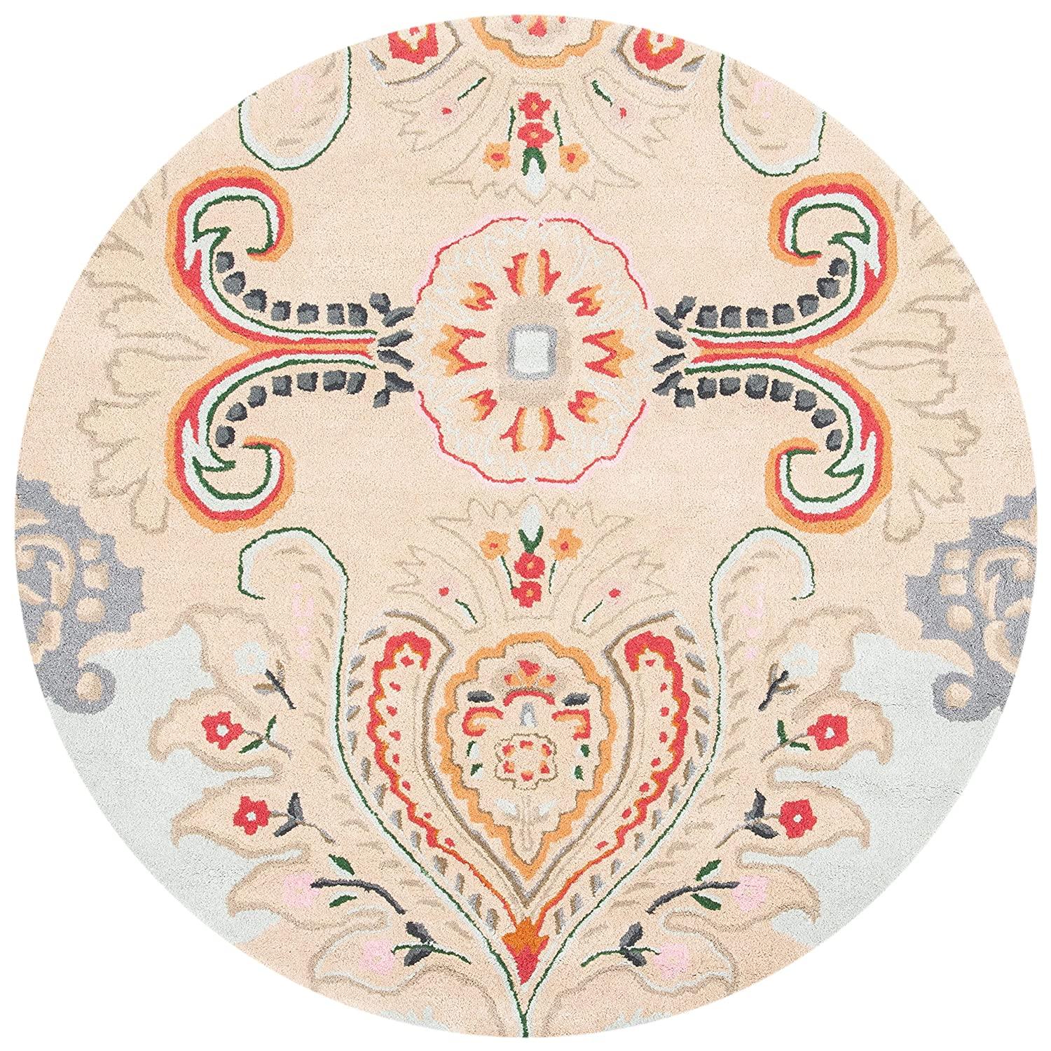 Peach peacock feather round wool carpet rug with floral motifs from Bhadohi Carpets House
