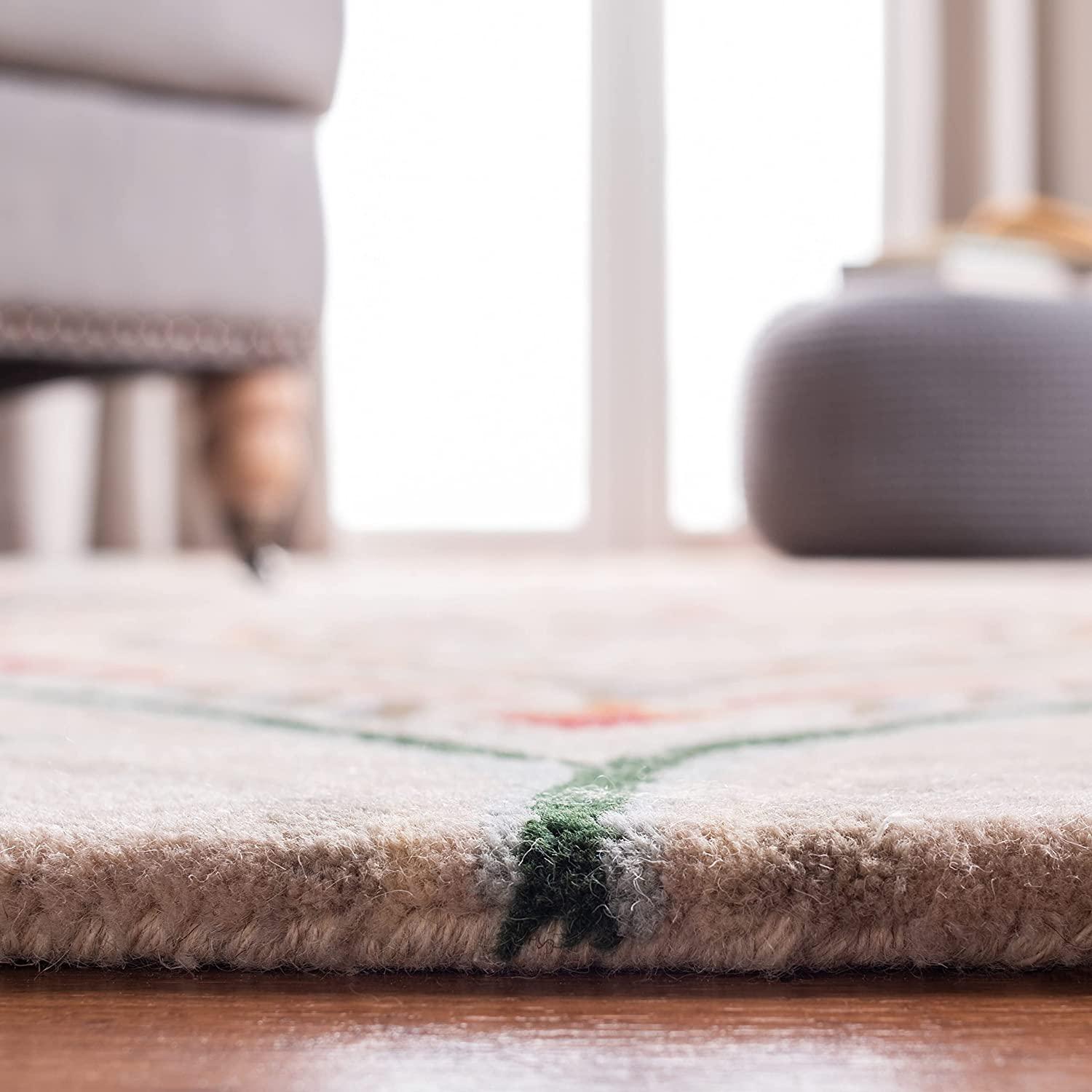 Close-up of Bhadohi Carpets House round peach wool rug with peacock feather design