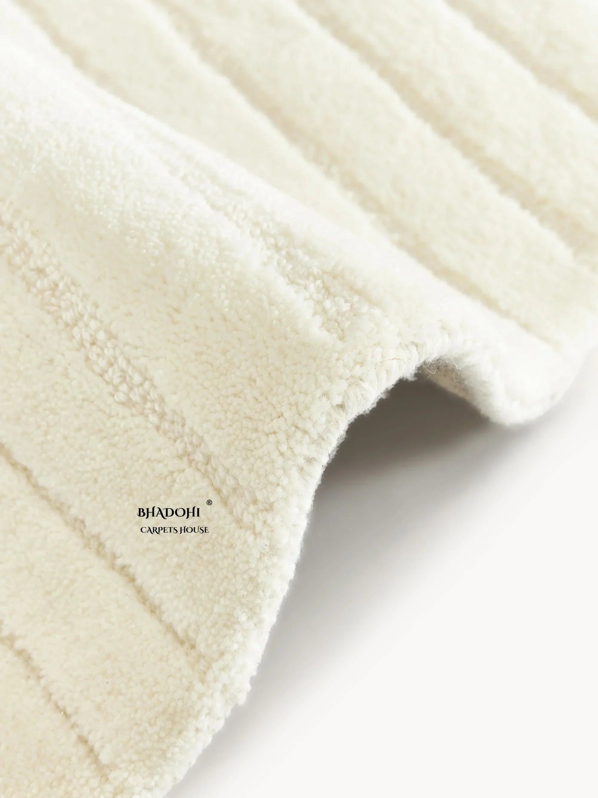 Close-up of a textured cream wool rug by Bhadohi Carpets House, premium carpet in India