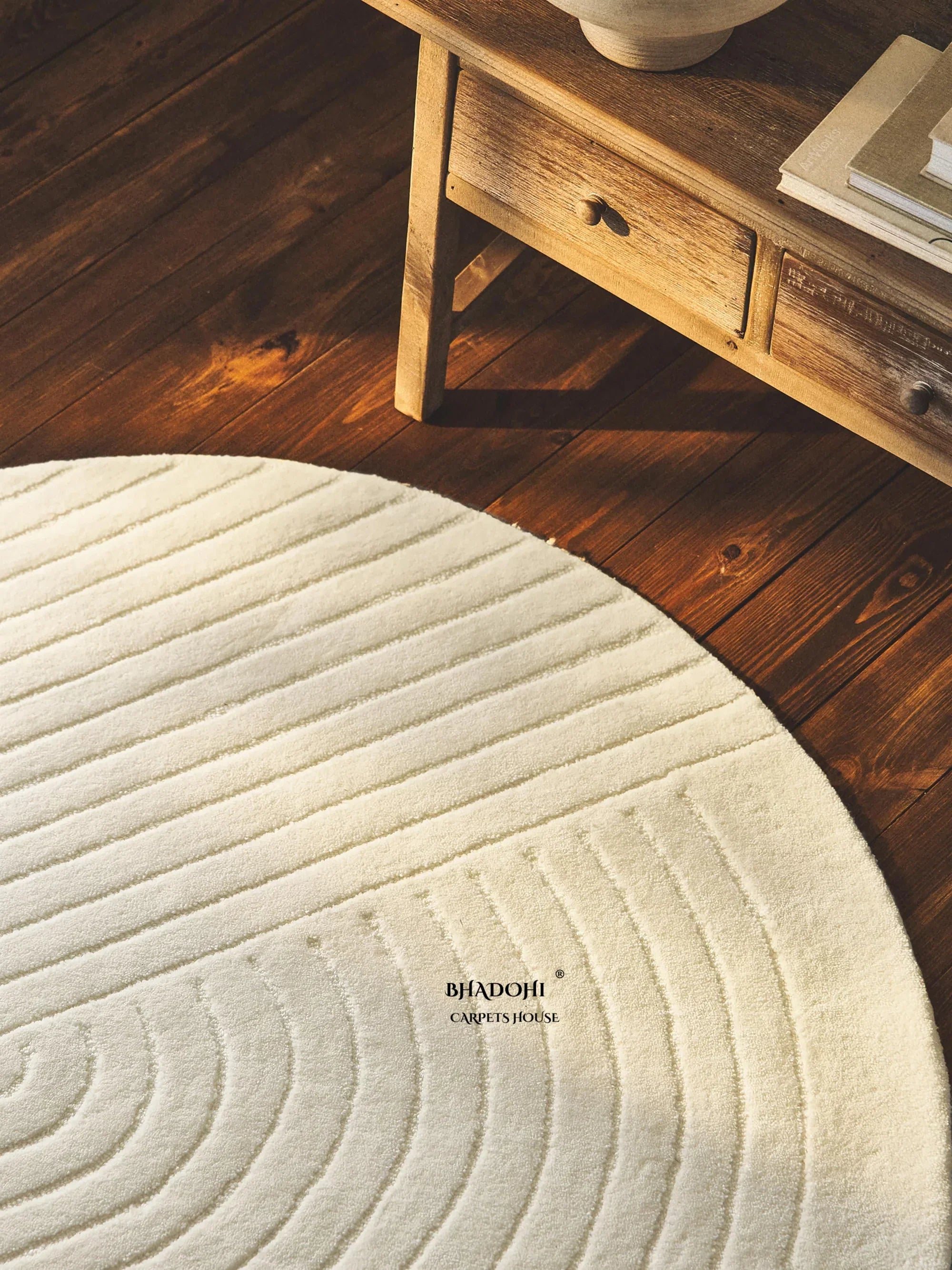 Round wool carpet rug by Bhadohi Carpets House on wooden floor with wooden table