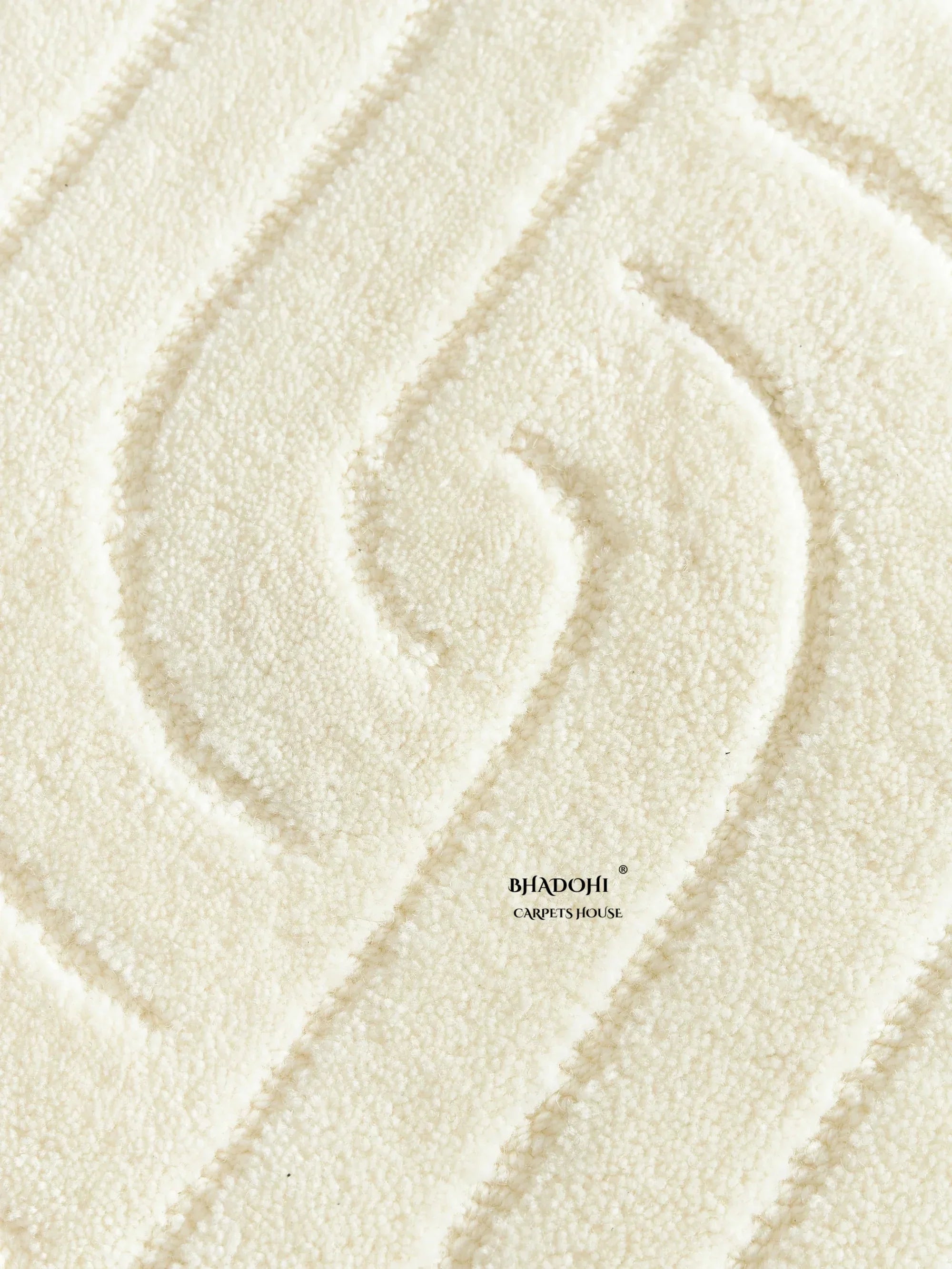 Cream textured wool carpet rug with modern raised pattern from Bhadohi Carpets House