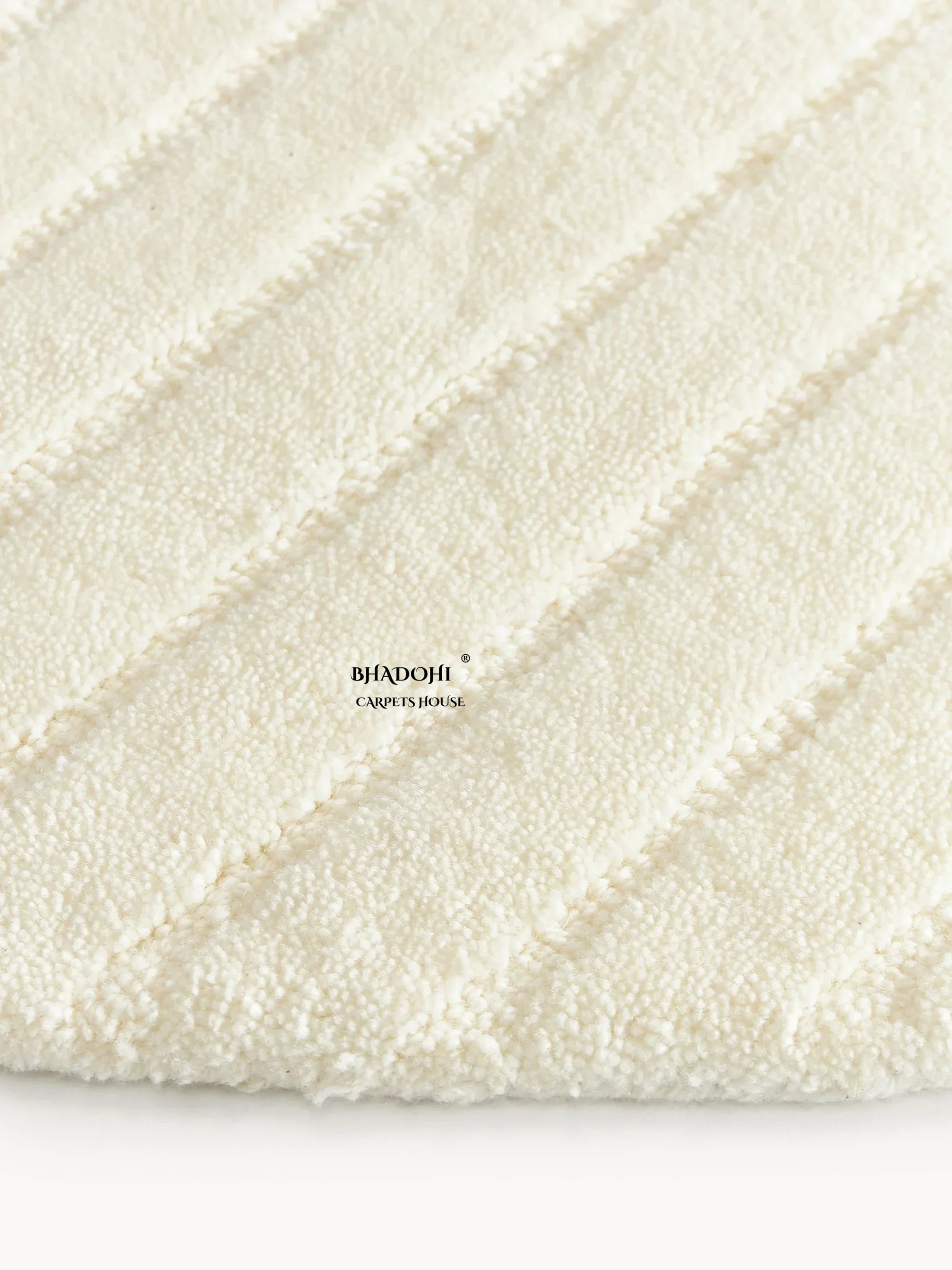 Close-up of Bhadohi Carpets House premium round wool rug with textured cream pattern
