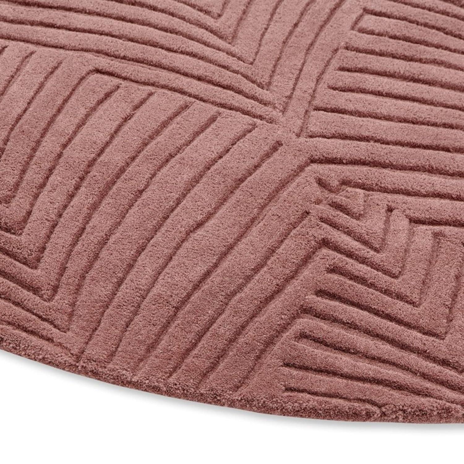 Textured round wool carpet in soft pink, modern geometric pattern from Bhadohi Carpets House