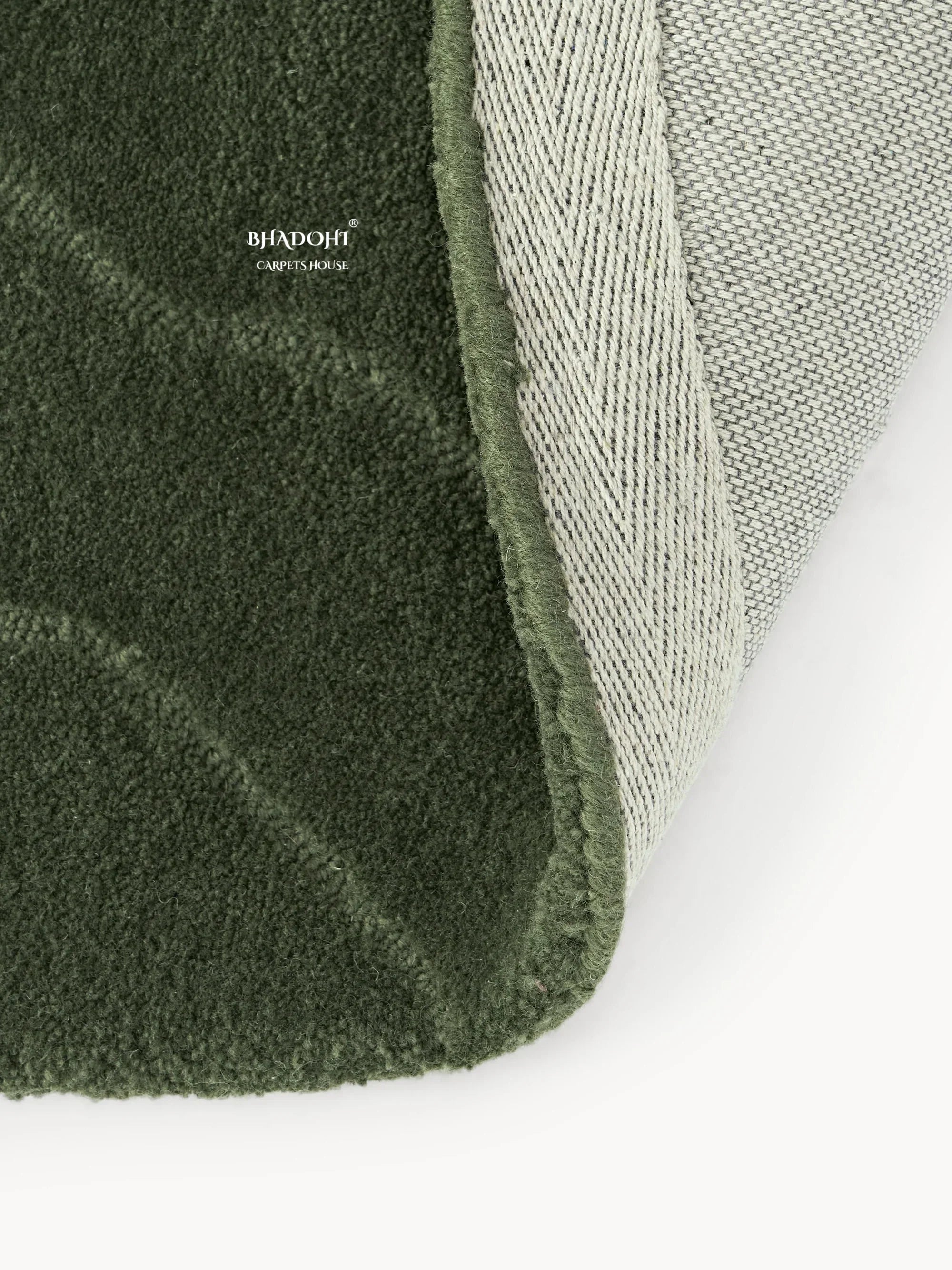 Green wool carpet close-up by Bhadohi Carpets House, textured and premium finish