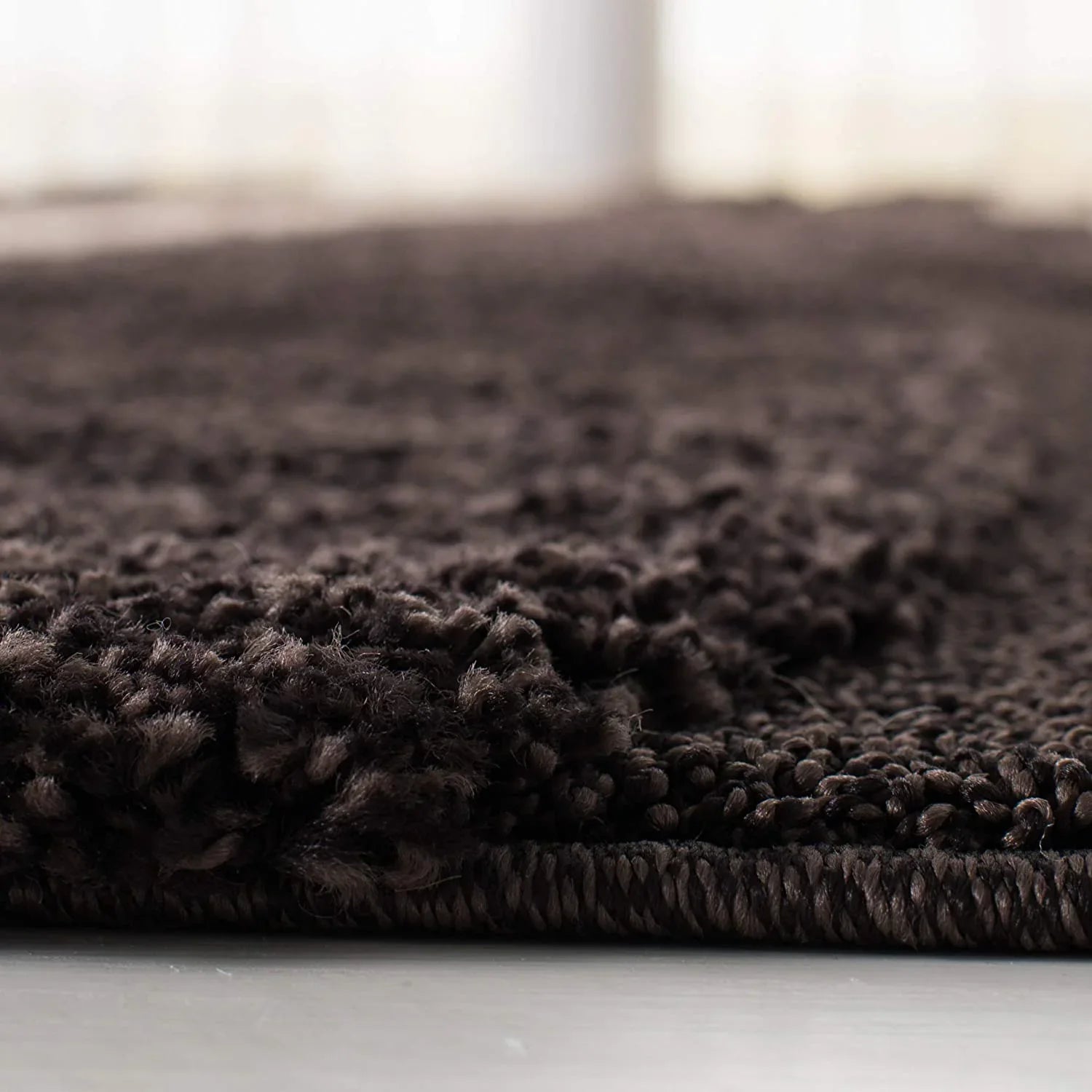 Close-up of a dark brown shaggy carpet rug, plush texture, Bhadohi Carpets House India