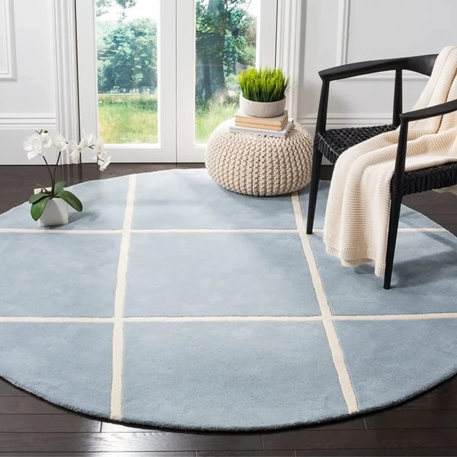Modern round wool carpet rug with grid pattern in bright living room, Bhadohi Carpets House