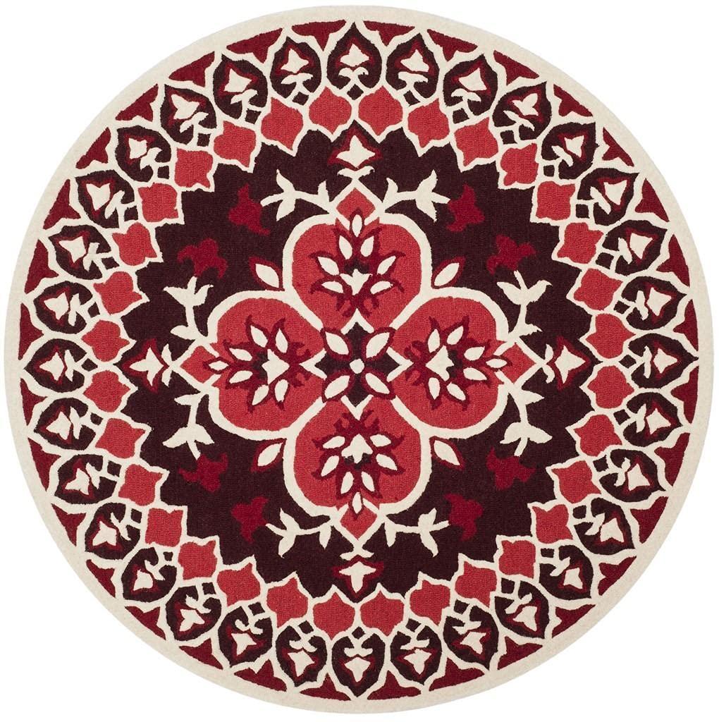 Round red and maroon wool carpet with intricate floral design, Bhadohi Carpets House