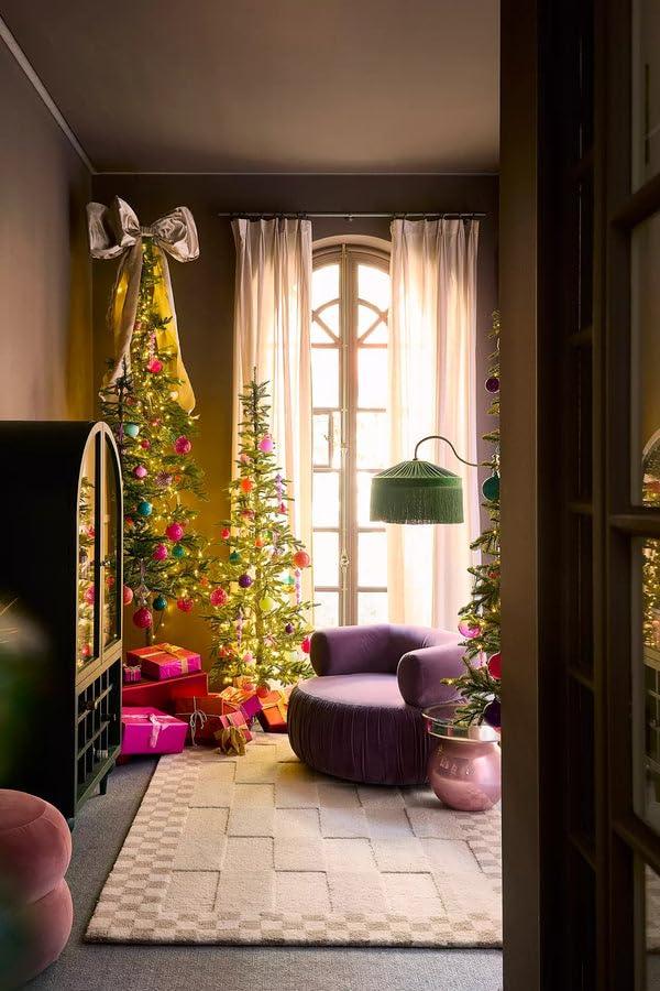 Modern living room with Bhadohi Carpets House cut-loop rug, festive Christmas trees, gifts