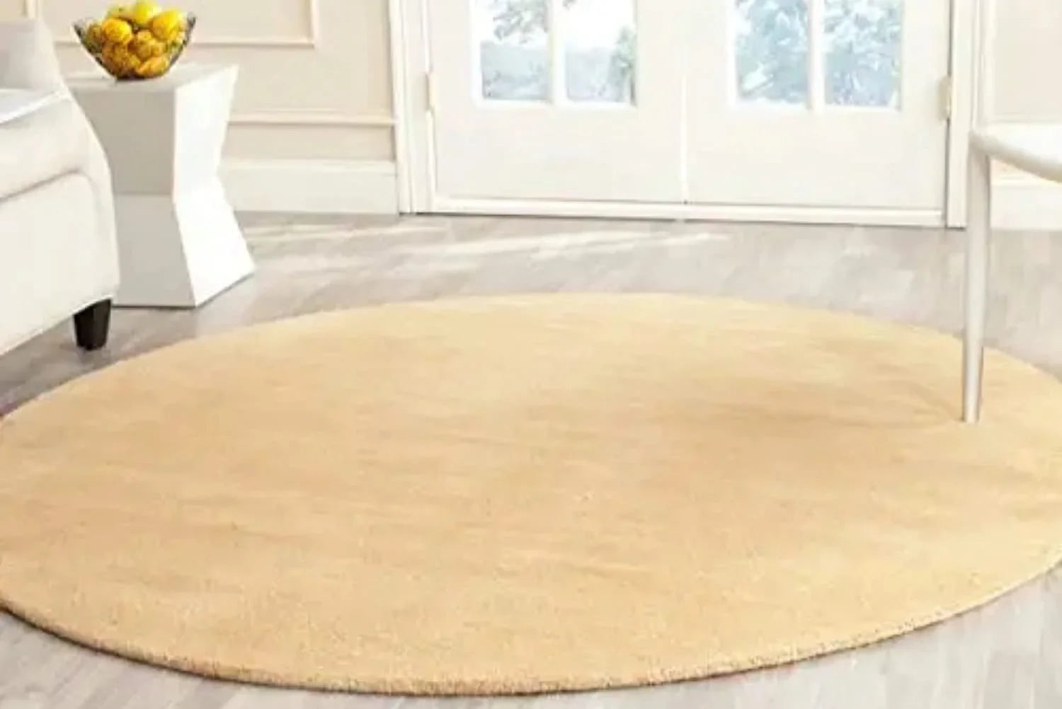 Beige round wool carpet rug in modern living room, Bhadohi Carpets House collection