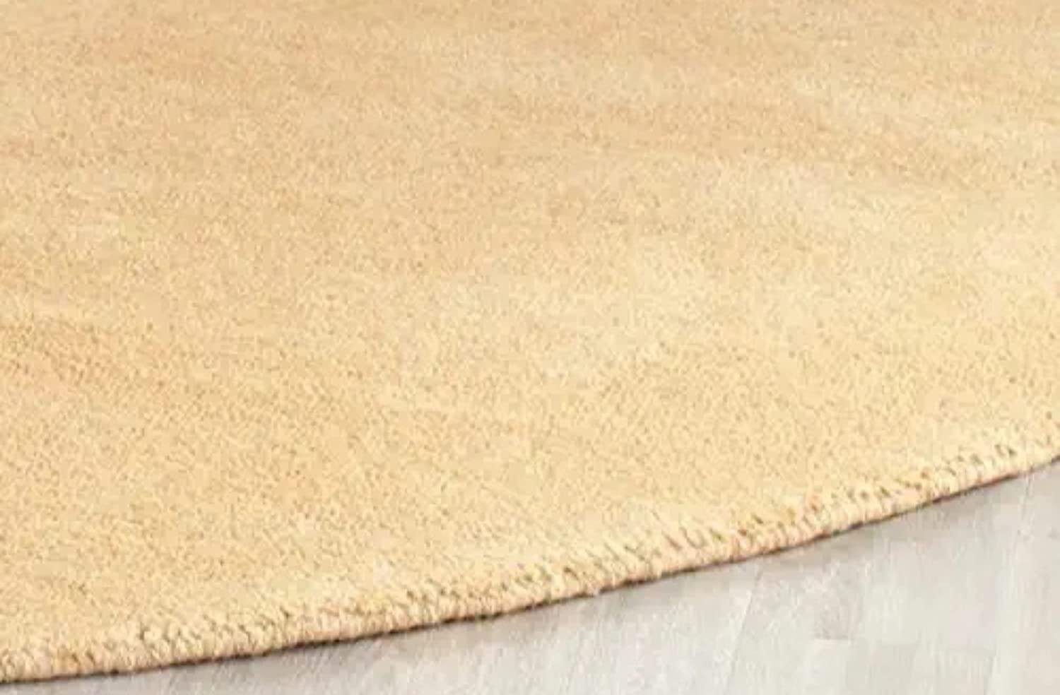 Beige round wool carpet rug on light wooden floor, Bhadohi Carpets House premium decor