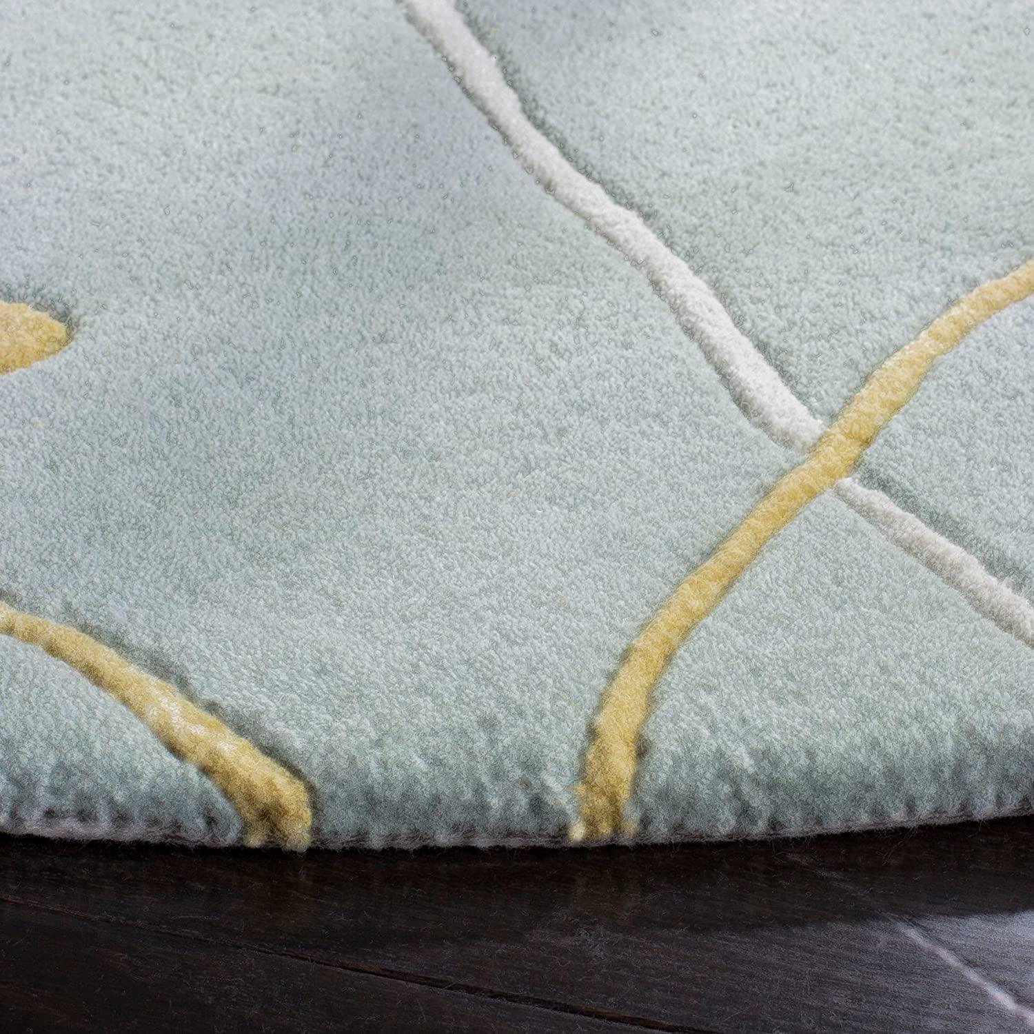 Sky blue round wool carpet with yellow and white abstract lines by Bhadohi Carpets House