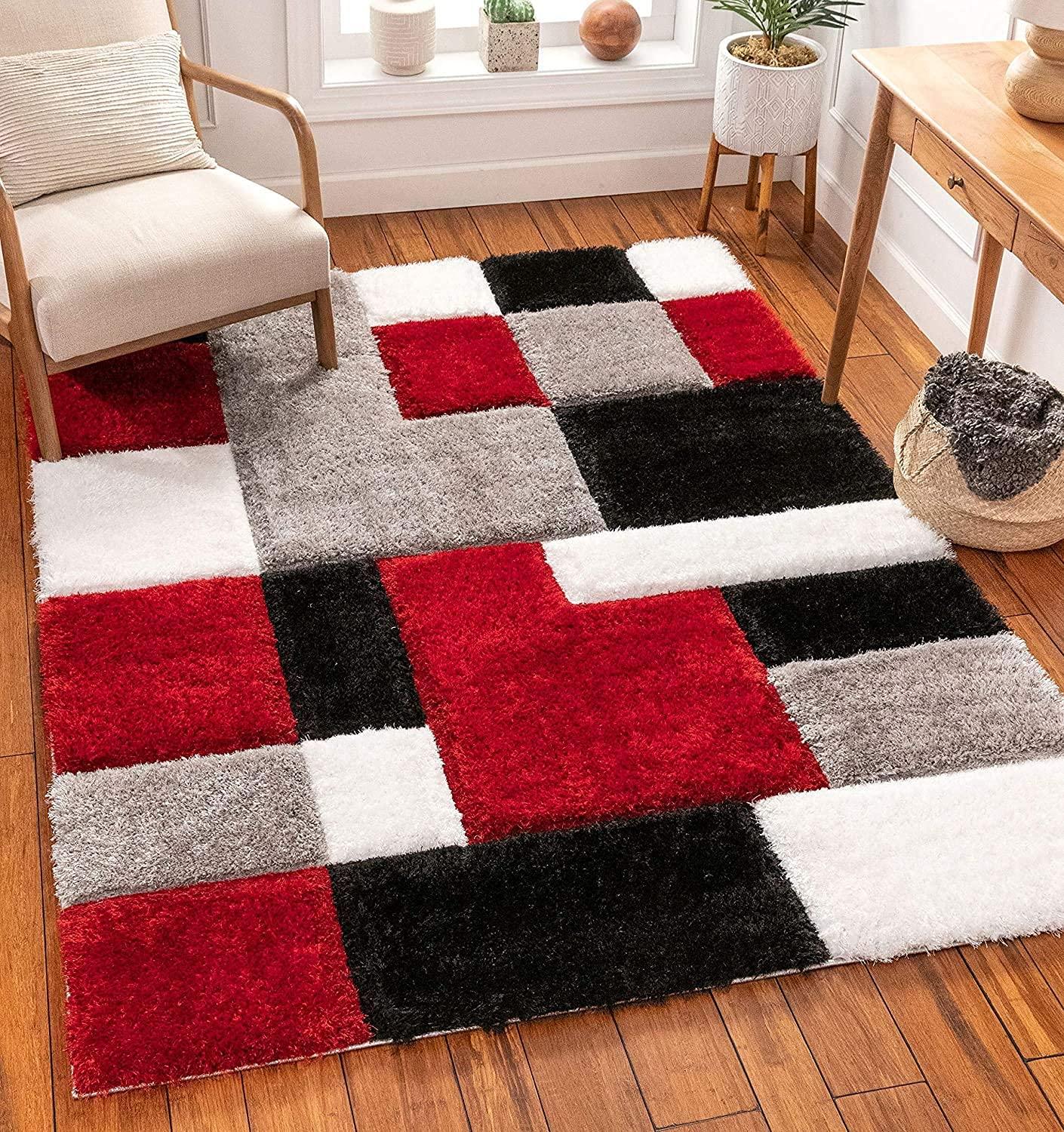 Modern shaggy carpet rug with red, black, white, and grey geometric blocks in a cozy living room