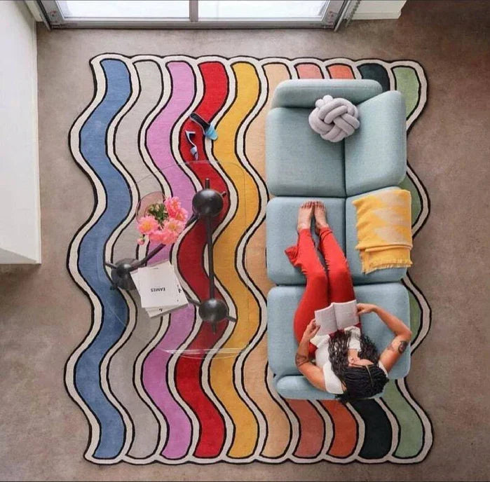 Modern living room with a colorful wavy carpet rug, sofa, and woman reading, Bhadohi Carpets House